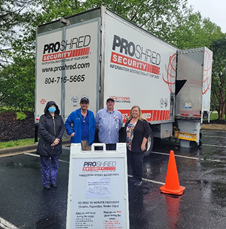 BFCU staff standing in front of the shred truck at the 2023 shred-a-thon