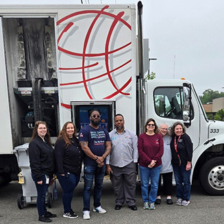 BFCU staff standing in front of the shred truck at the 2024 shred-a-thon
