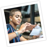 Picture of someone using their phone to remote deposit a check