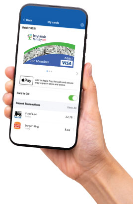 Image of a user holding their phone while the phone is displaying the BFCU app