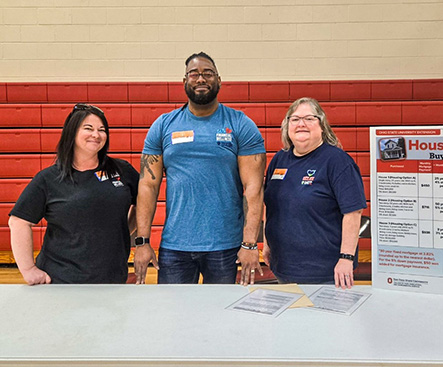 BFCU staff volunteering at a reality store experience at a local middle school.